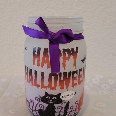 Lot 46: (8) Halloween Candles and Luminary Jar 