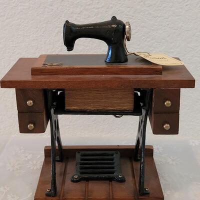 Lot 111: Antique Sewing Machine Music Box