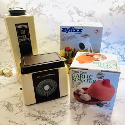 Lot 143 Group 4 Kitchen Items Ice Crusher Scale Salad Shooter Garlic Roaster