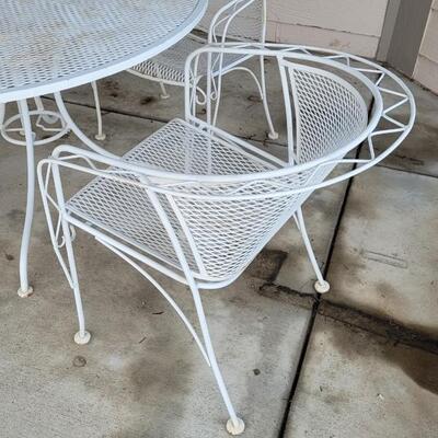 Lot 131: Vintage Wrought Iron Outdoor Table & Chairs 