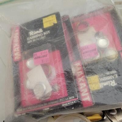 Lot 164: Assorted Sewing Essentials Bundle - Rhinestone Setters, Fabric Rulers and More