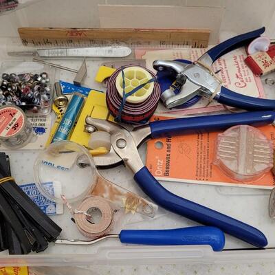 Lot 164: Assorted Sewing Essentials Bundle - Rhinestone Setters, Fabric Rulers and More