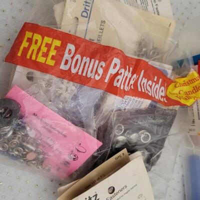 Lot 164: Assorted Sewing Essentials Bundle - Rhinestone Setters, Fabric Rulers and More