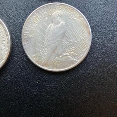Antique silver dollar collection of four. Includes two 1921 Morgans and two 1922 Peace. Lot A16