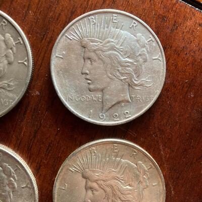Peace silver dollar collection of four. Includes 1922, 1923, 1924, 1926. Lot A18