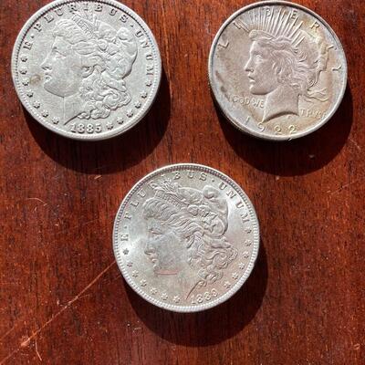 Antique silver dollar collection of three. Includes 1885, 1889, 1922. Lot A19