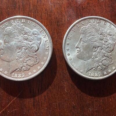 Pair of 1889 Morgan silver dollars. Lot A22