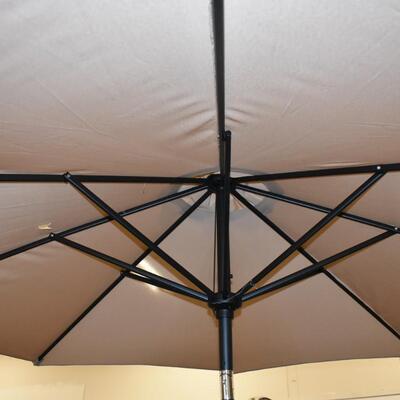Mainstays 9 Outdoor Tilt Market Patio Umbrella - Tan. Small Tear as shown