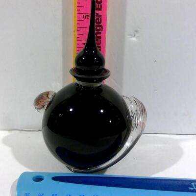 Art glass ebony bottle and applicator with clear wave swirls on side