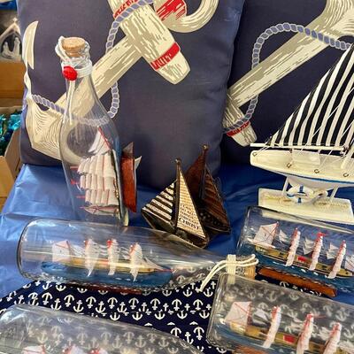 Nautical party decor lot: ship in bottle, anchor placemats, pillows,, sailboat