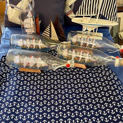 Nautical party decor lot: ship in bottle, anchor placemats, pillows,, sailboat