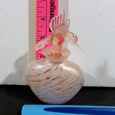 Opalescent perfume bottle with pinkish hummingbird stopper