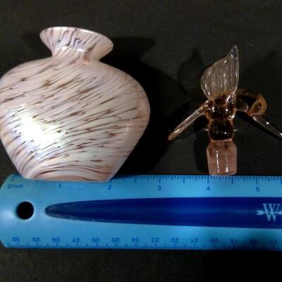 Opalescent perfume bottle with pinkish hummingbird stopper