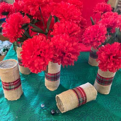 Lot of seven homemade vases: burlap cover jars with red flowers