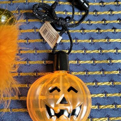 Lot 257: Halloween Pen, Cat Halloween Collar and Bubble Container Necklace 
