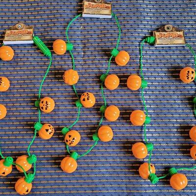 Lot 259: (3) Jumbo Blinking Pumpkin Necklaces