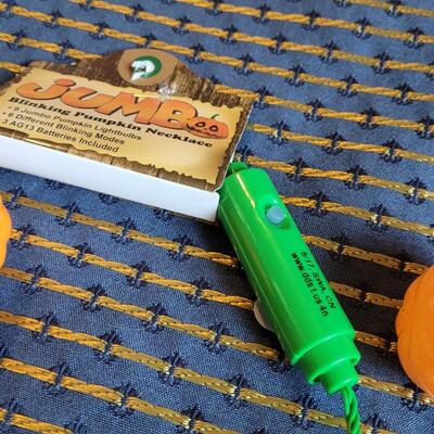 Lot 259: (3) Jumbo Blinking Pumpkin Necklaces
