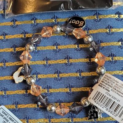 Lot 265: Flashing Halloween Necklaces, Hair Glitter and Bracelets 