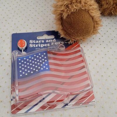 Lot 293: Assorted NEW Patriotic Items - Singing Bear, 4th of July Glow Batons + LED Flag