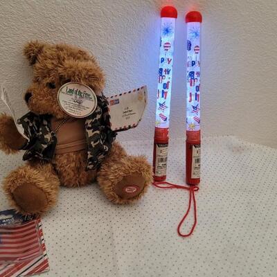 Lot 293: Assorted NEW Patriotic Items - Singing Bear, 4th of July Glow Batons + LED Flag