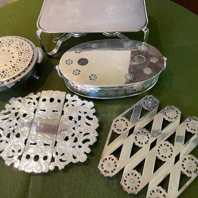 Lot 304  Silver Plate Trivets & Warmers