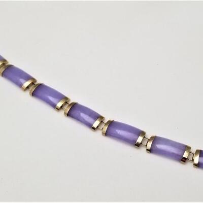 Lot #72  Polished  purple stone bracelet set in 14kt gold