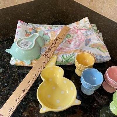 #696 Easter table Cloth, Egg holders and rabbit dishes. 