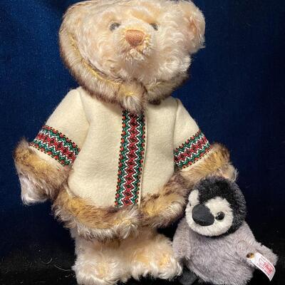 Teddy bear Eskimo with penguin