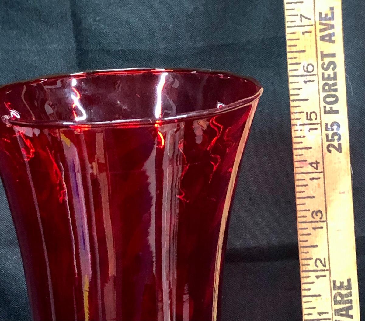 Large red glass vase with clear pedestal base