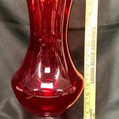 Large red glass vase with clear pedestal base