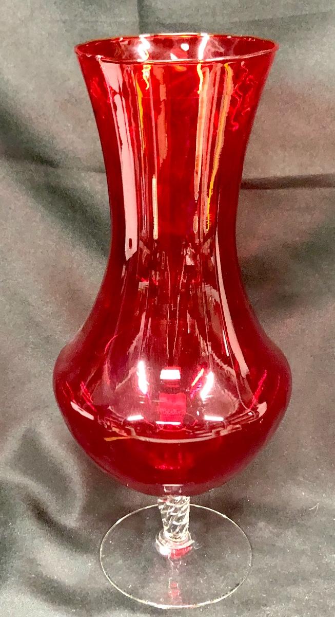 Large red glass vase with clear pedestal base
