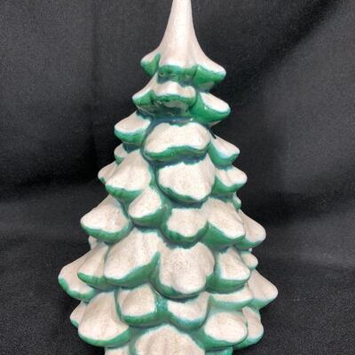 Ceramic green Christmas tree with white snow, approximately 9 inches tall