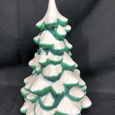 Ceramic green Christmas tree with white snow, approximately 9 inches tall