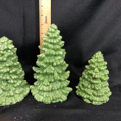 Three green Christmas trees light up figurines