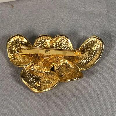 Lot 13 - Gold Tone Mask Collage Brooch