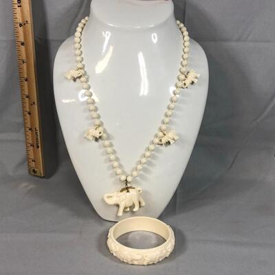 Lot 16 - Elephant Necklace and Bangle Bracelet