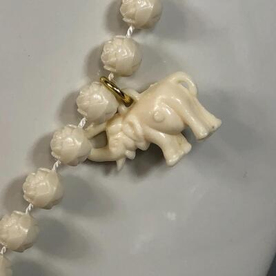 Lot 16 - Elephant Necklace and Bangle Bracelet