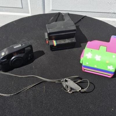 Collection of three vintage cameras with rare Barbie Polaroid