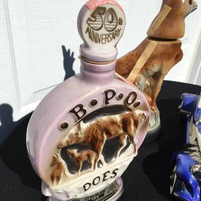 JIM BEAM Collection of three collectible bottles 12 to 14 inches with stag and race car