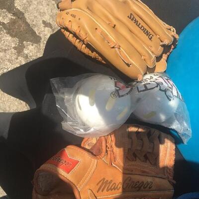 Mixed sports equipment lot with bats, balls and gloves