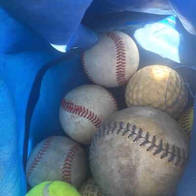 Mixed sports equipment lot with bats, balls and gloves