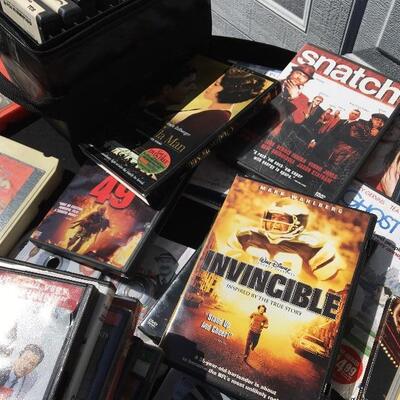 Collection of movie and media with 41 DVDs and 12 eight track tapes