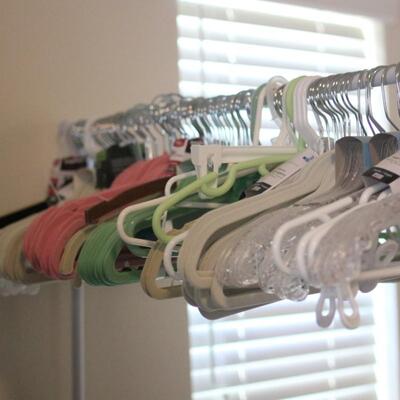 Lot 144 Clothing Rack w/ Bins of Hangers