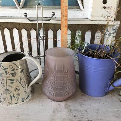 Lot of watering cans and vases