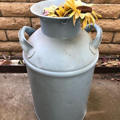 Blue Milk jug with flowers outdoor decor