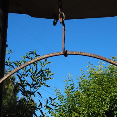 Lot 81 Rustic iron hanger and large terracotta low planter pot