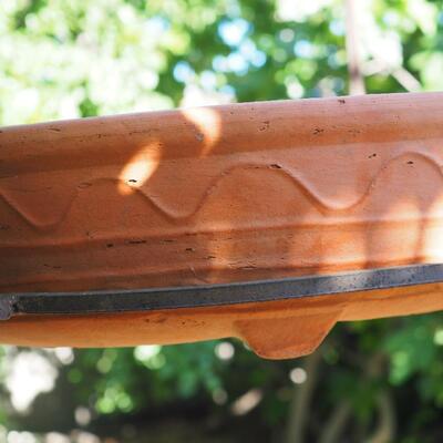 Lot 81 Rustic iron hanger and large terracotta low planter pot