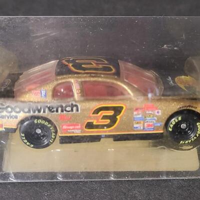 Lot 153: Nascar Collectibles: Warner Bros, Goodwrench and More