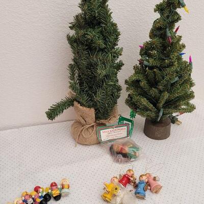 Lot 34: Large Assortment of Christmas Wooden Figures + (2) Small Table top Trees w/ Lights (both work)