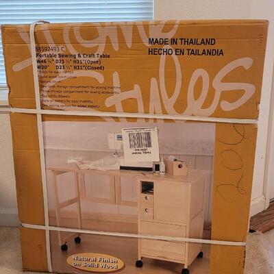 Lot 56: New in Box Portable Sewing and Crafting Table 